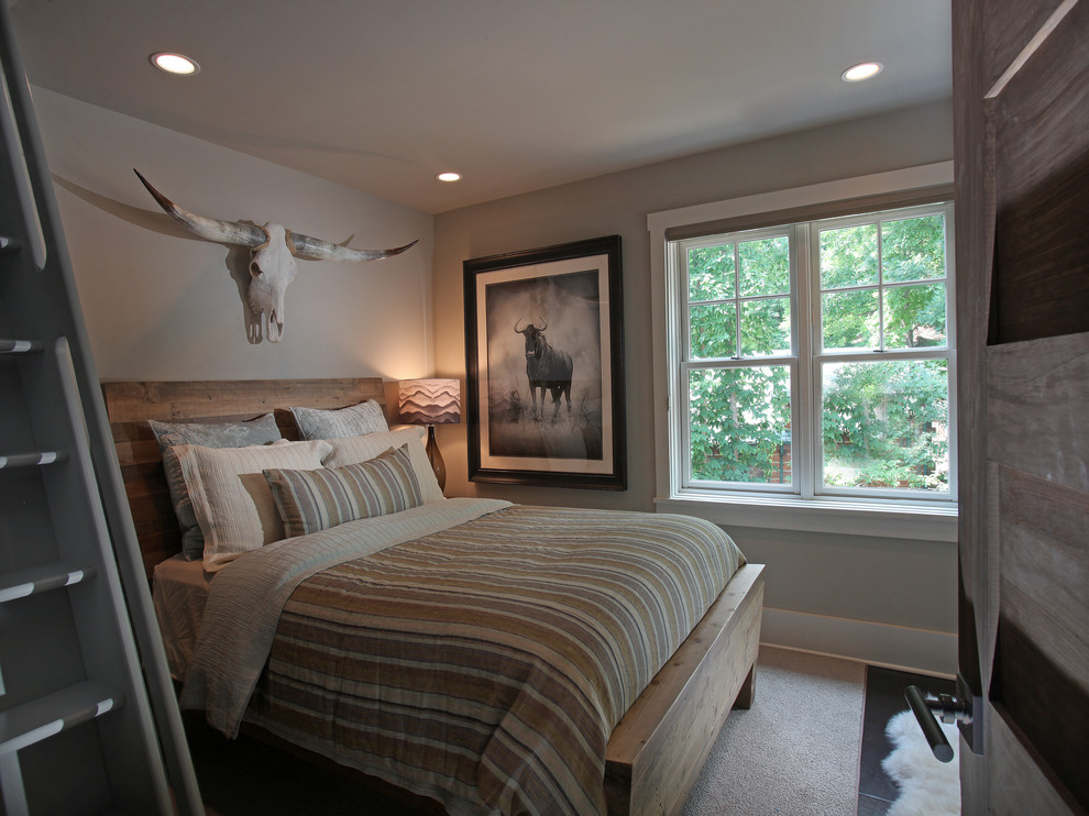 Photo of a medium sized rustic guest bedroom in Atlanta with beige walls and carpet.