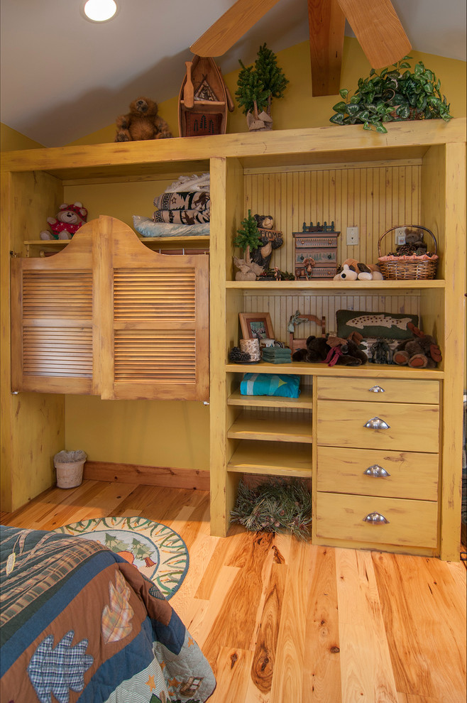 Bedroom - small rustic light wood floor bedroom idea in Denver with yellow walls