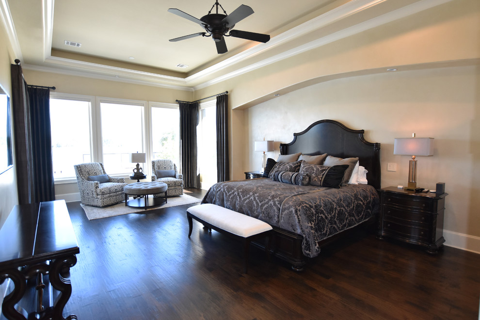 Bedroom - large mediterranean master medium tone wood floor bedroom idea in Houston with beige walls and no fireplace