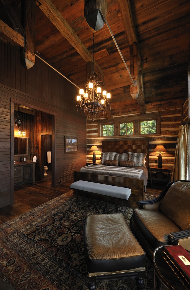 Inspiration for a rustic bedroom in Minneapolis with dark hardwood flooring.