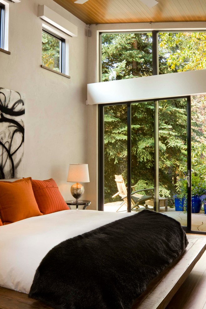 Contemporary bedroom in Denver with beige walls.