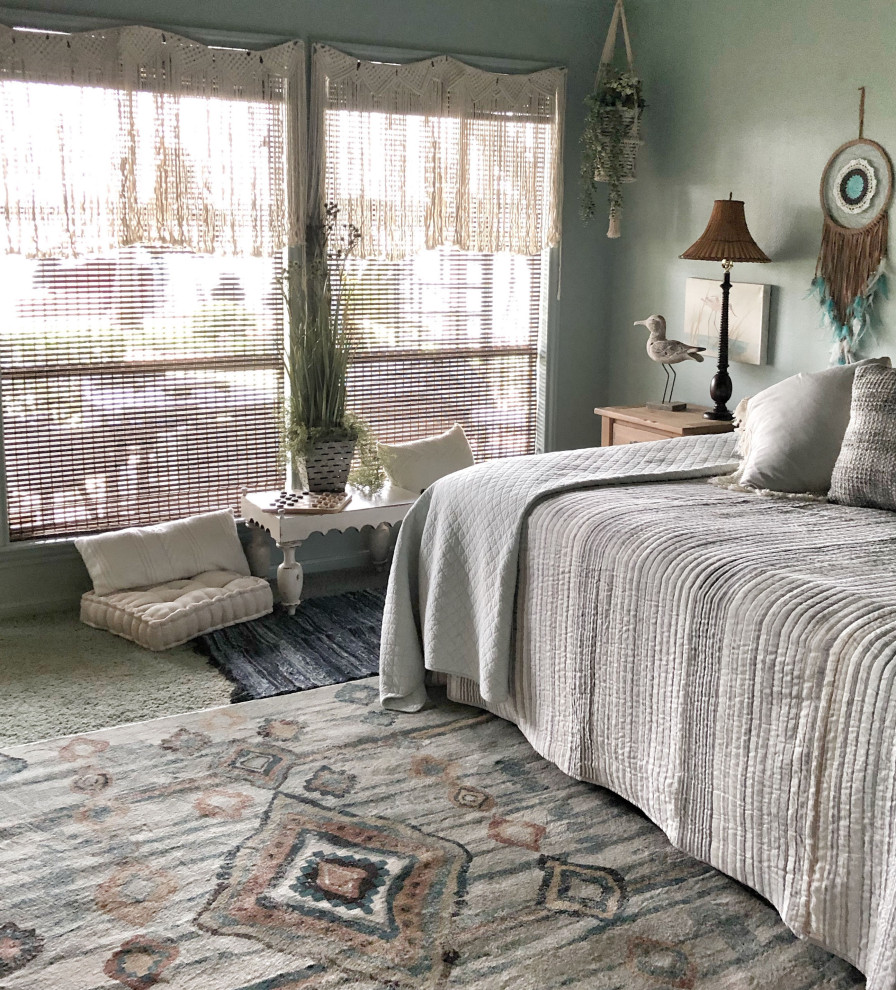 Inspiration for a medium sized coastal guest bedroom in Houston with blue walls, carpet and blue floors.
