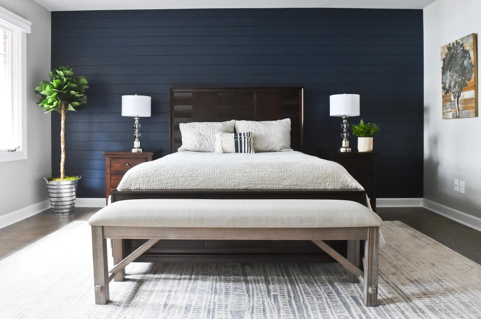 Classic master bedroom in Charlotte with blue walls and tongue and groove walls.