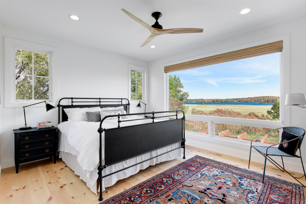 Bedroom - mid-sized farmhouse master light wood floor and beige floor bedroom idea in Minneapolis with white walls and no fireplace