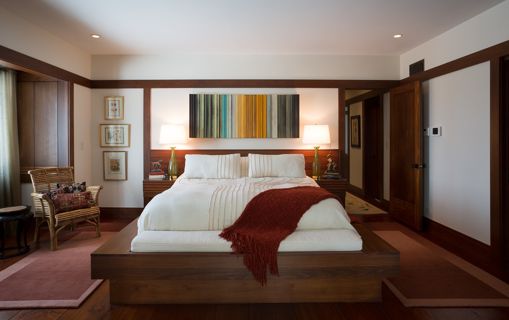 Bedroom - large transitional master medium tone wood floor bedroom idea in Chicago with white walls