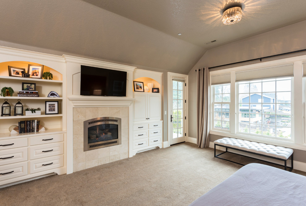Inspiration for a huge transitional master carpeted and beige floor bedroom remodel in Portland with gray walls, a standard fireplace and a wood fireplace surround