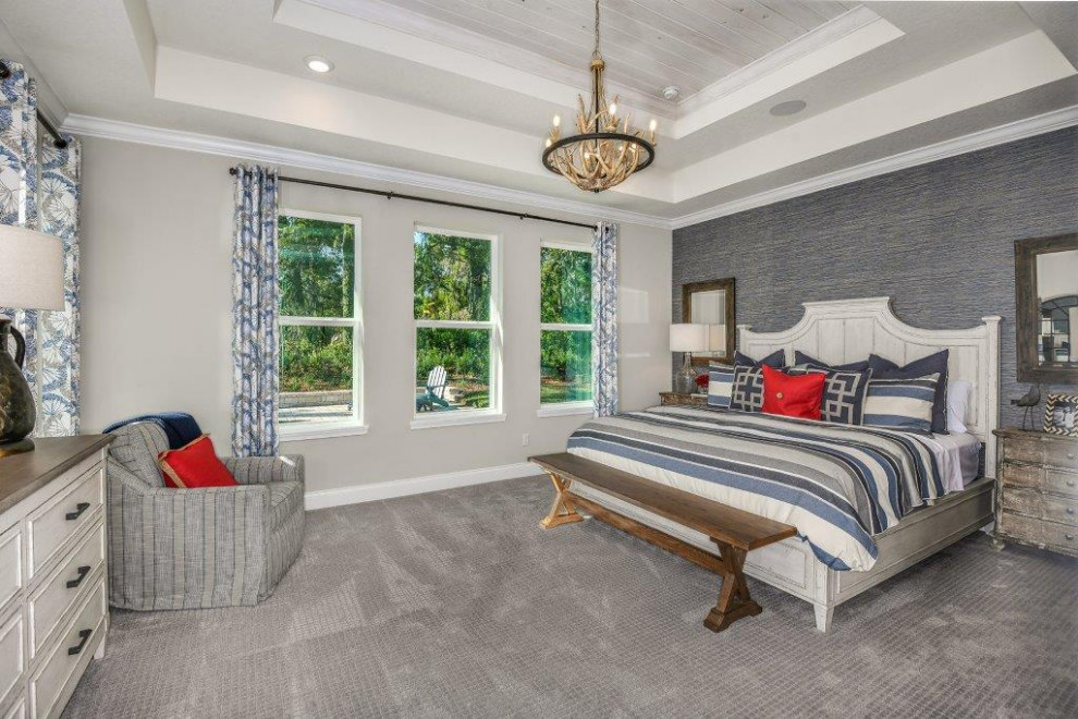 Mittelgroßes Uriges Hauptschlafzimmer ohne Kamin mit bunten Wänden, Teppichboden und grauem Boden in Orlando