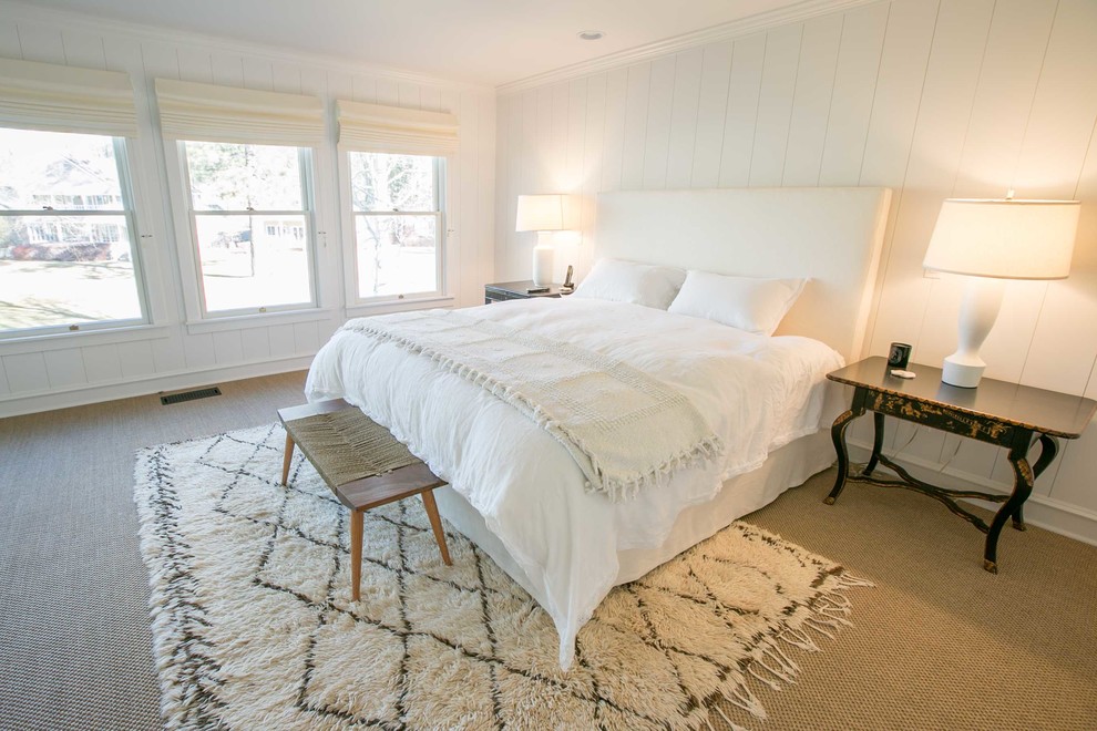 Example of a large arts and crafts master carpeted bedroom design in Other with white walls