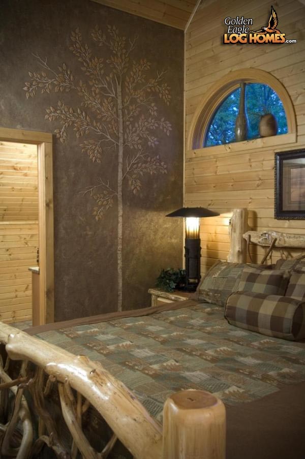 Example of a large mountain style bedroom design in Other