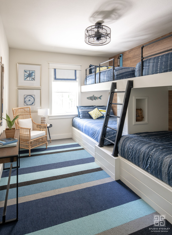 Medium sized modern guest bedroom with white walls, carpet and blue floors.