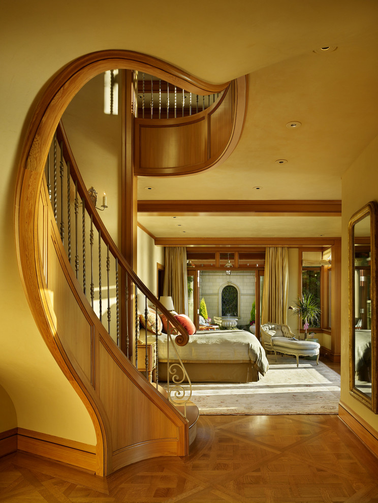 Large elegant master medium tone wood floor and brown floor bedroom photo in Seattle with beige walls and no fireplace