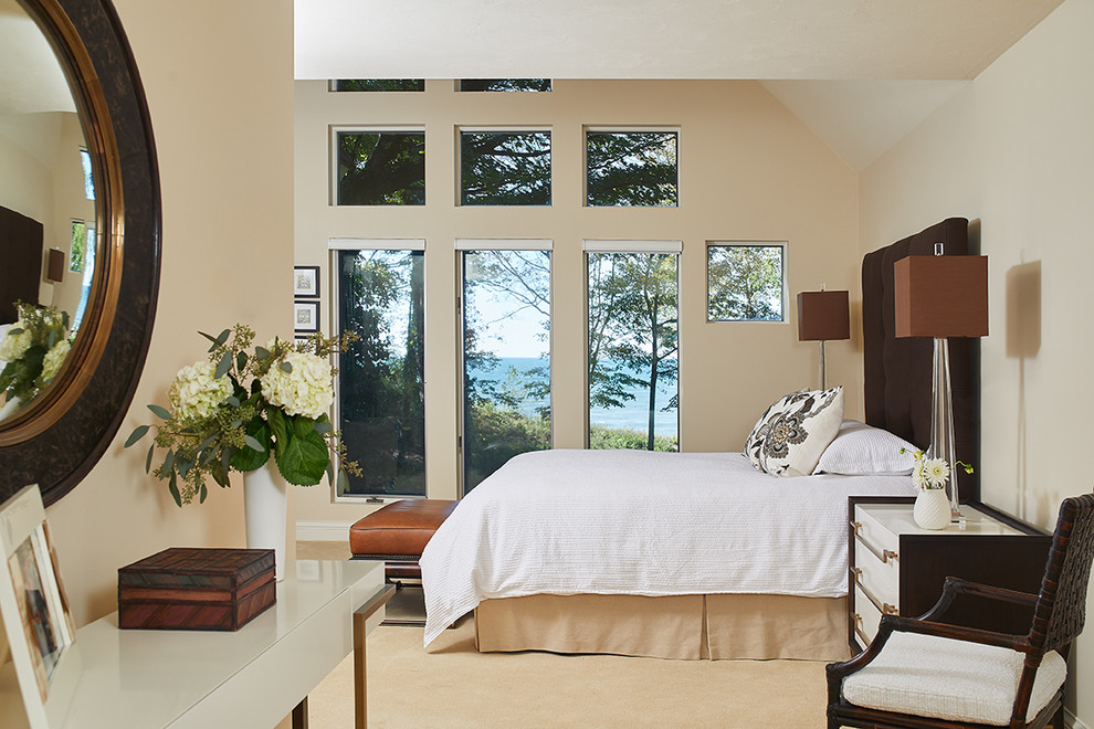 Transitional master carpeted, vaulted ceiling and beige floor bedroom photo with beige walls