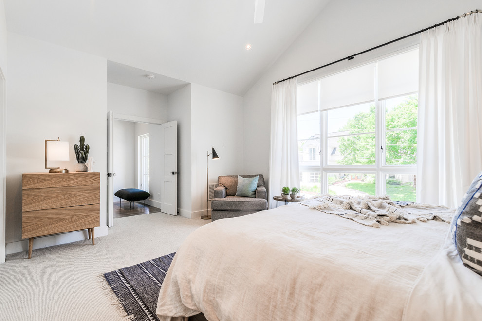Large contemporary guest bedroom in Dallas with white walls, carpet, no fireplace and beige floors.