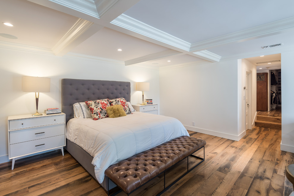Inspiration for a large timeless master medium tone wood floor bedroom remodel in Los Angeles with white walls and no fireplace