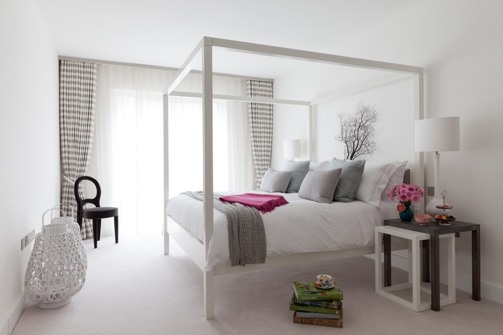Design ideas for a traditional grey and pink bedroom in London.