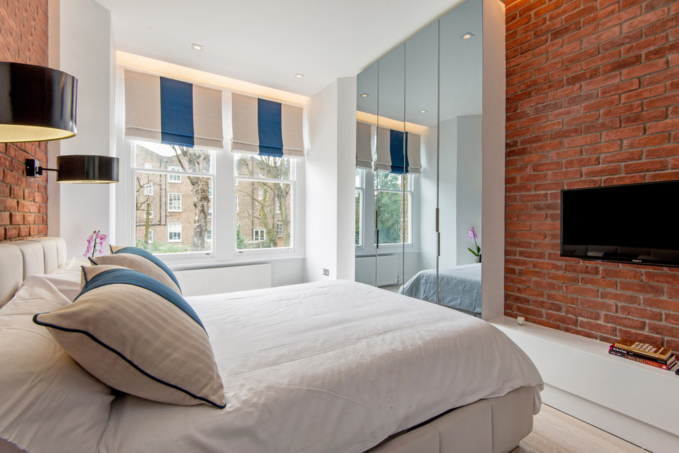 Inspiration for a large contemporary master bedroom in London with multi-coloured walls and dark hardwood flooring.