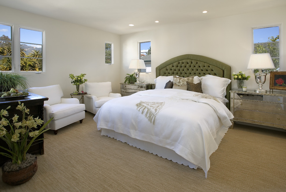 This is an example of a mediterranean bedroom in Santa Barbara with carpet.