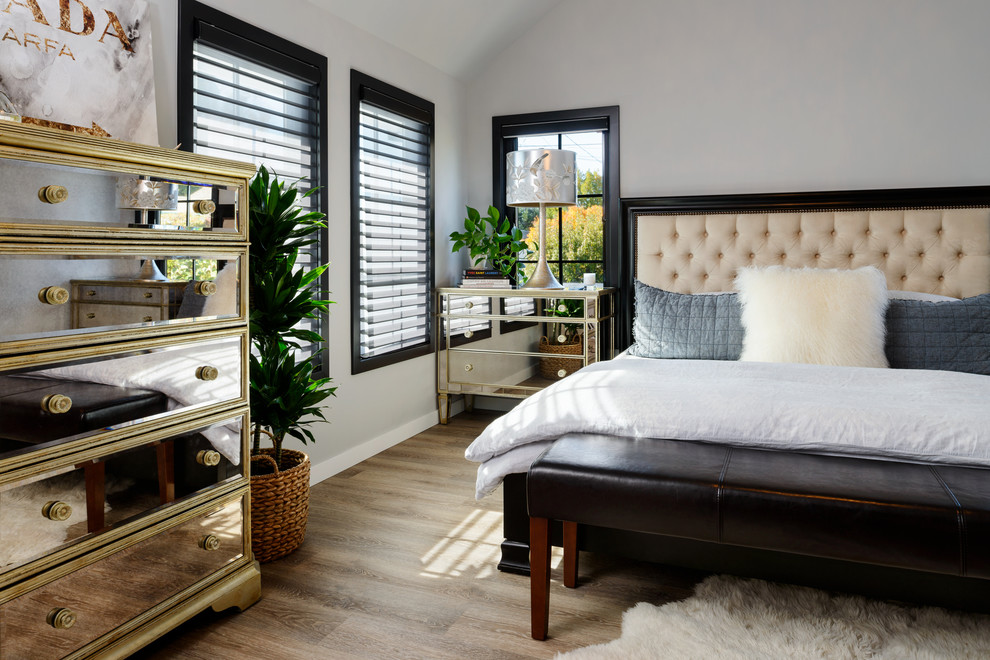 Идея дизайна: хозяйская спальня среднего размера в стиле неоклассика (современная классика) с серыми стенами, полом из винила, стандартным камином, фасадом камина из плитки и бежевым полом