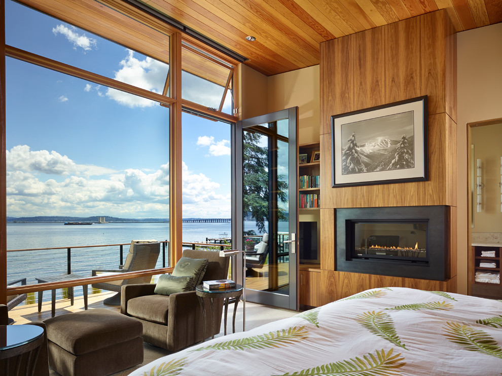 Modernes Schlafzimmer mit Kaminumrandung aus Metall in Seattle