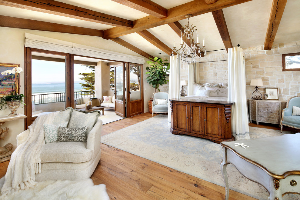Large classic master bedroom in San Francisco with beige walls, medium hardwood flooring and brown floors.