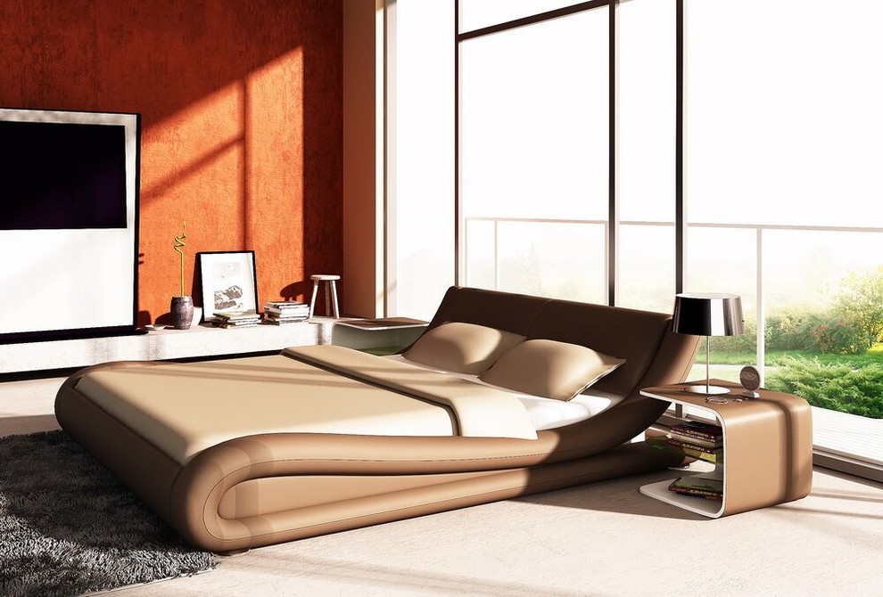 Large modern master bedroom in Toronto with orange walls, no fireplace, beige floors and light hardwood flooring.