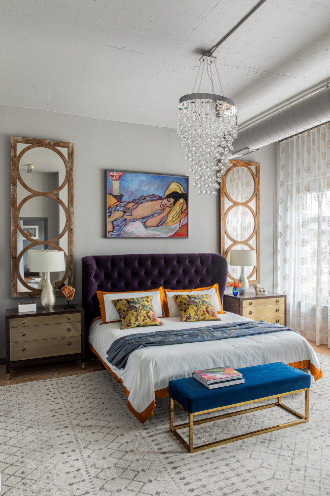 Medium sized eclectic master bedroom in Boston with medium hardwood flooring, no fireplace, grey walls and beige floors.