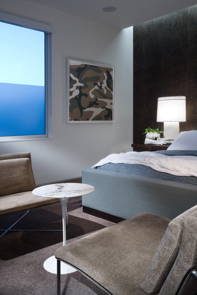 This is an example of a modern bedroom in Dallas with white walls.