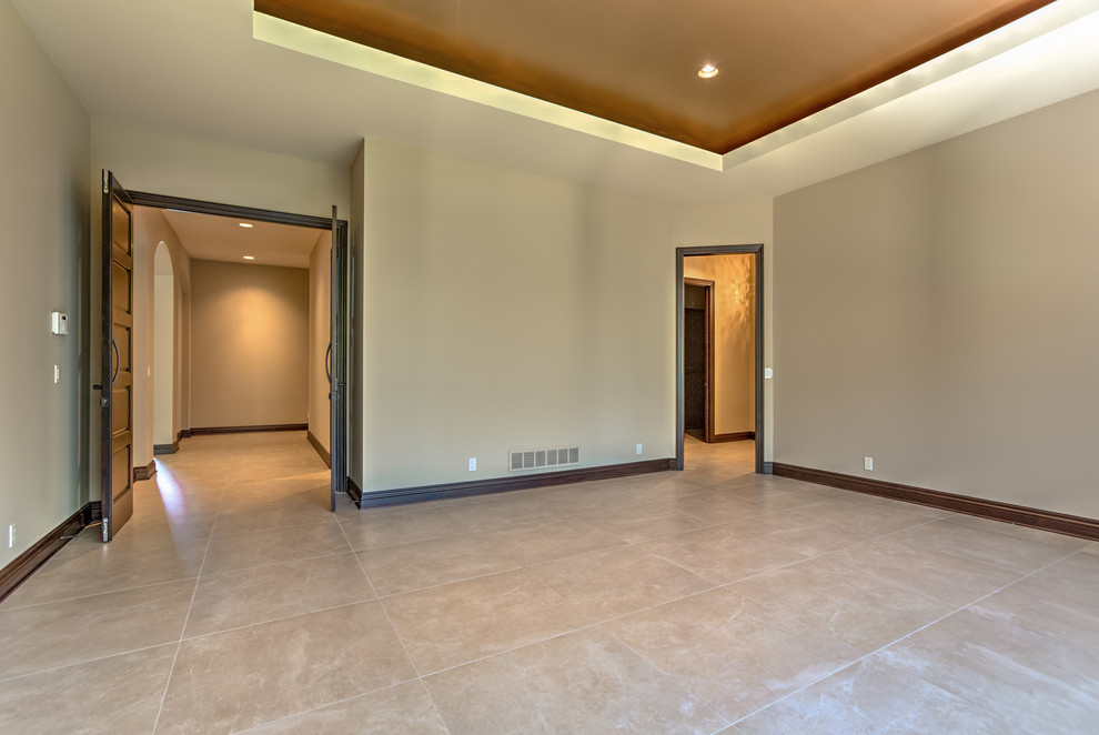 Huge trendy master porcelain tile bedroom photo in Omaha with beige walls and no fireplace