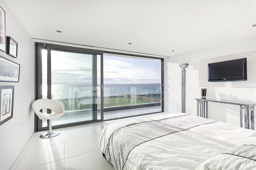 Contemporary bedroom in Hampshire with white walls.