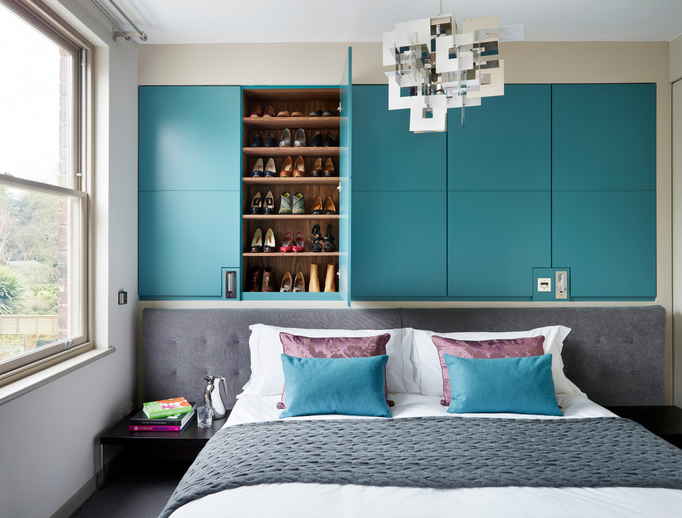 Trendy master carpeted bedroom photo in London