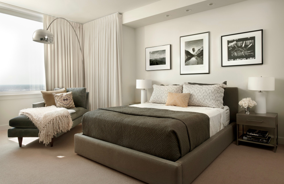 This is an example of a contemporary bedroom in Chicago with white walls, carpet and beige floors.