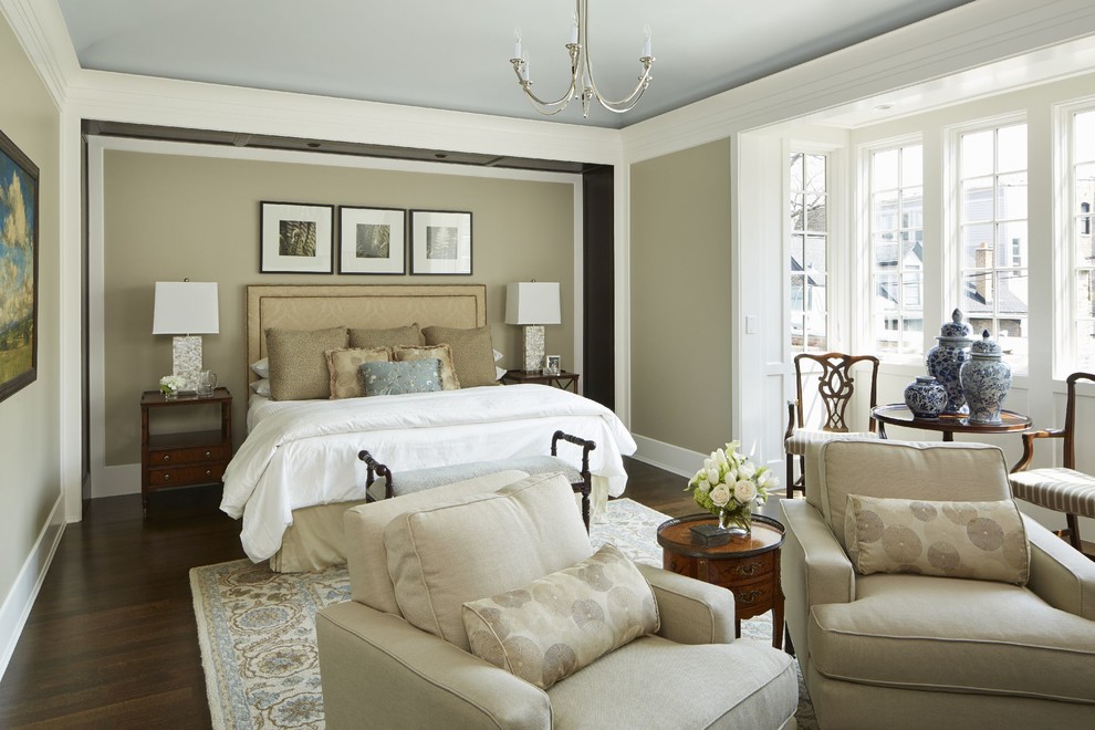 Design ideas for a large classic master bedroom in Chicago with beige walls and dark hardwood flooring.
