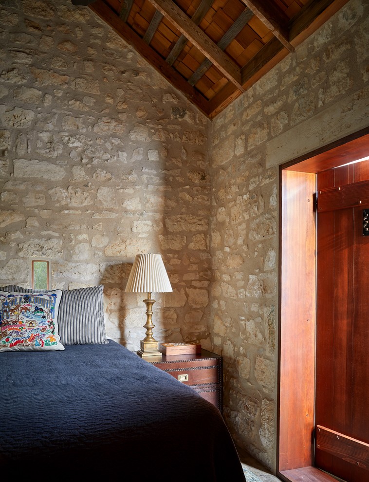 Photo of a farmhouse bedroom in Austin.