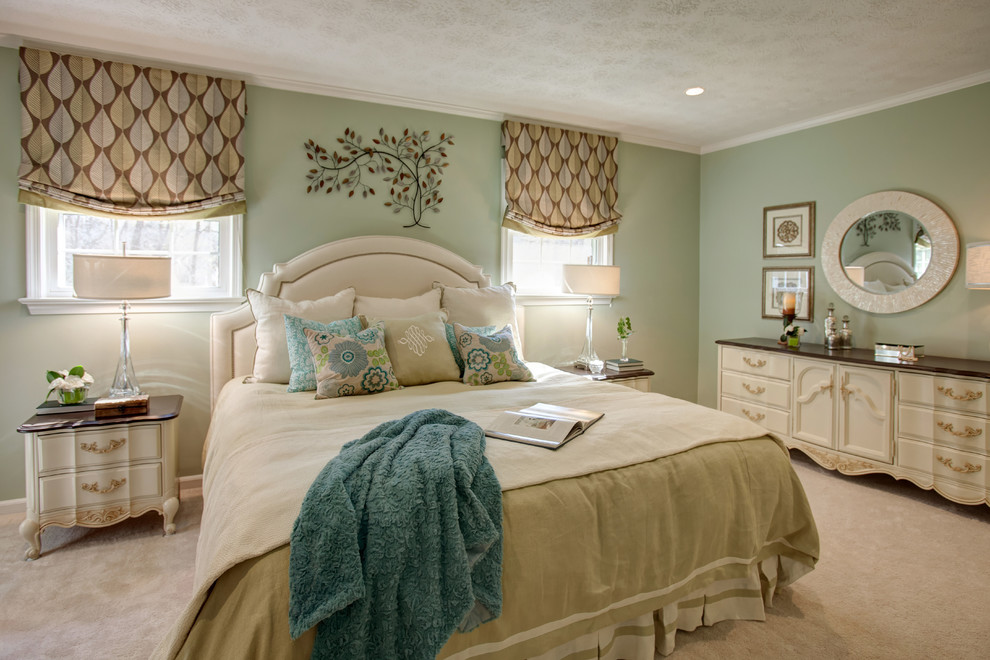 This is an example of a large traditional master bedroom in Richmond with green walls, carpet and no fireplace.