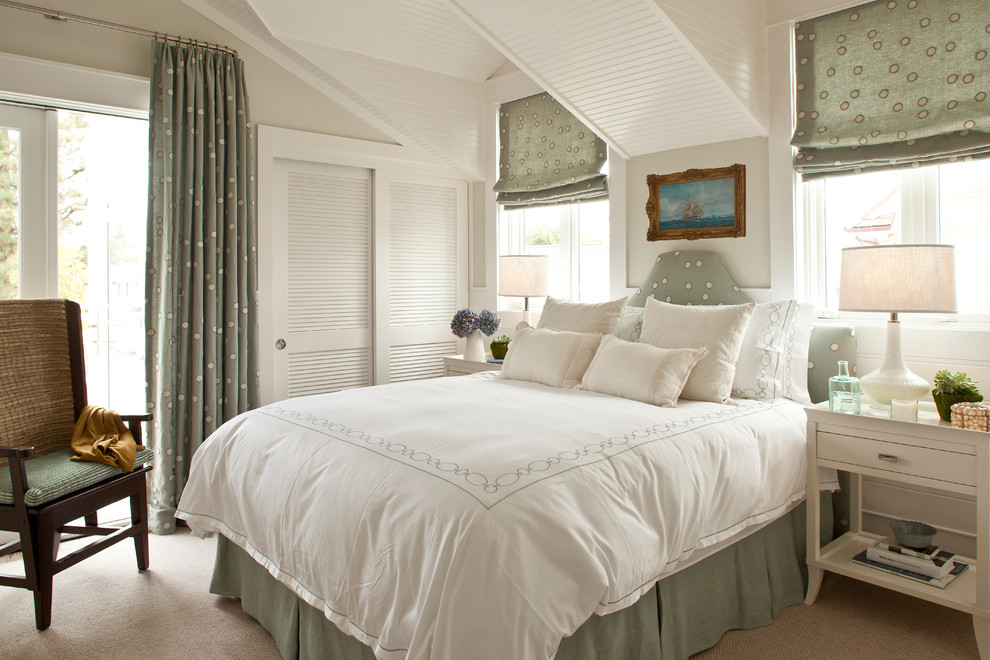 Example of a mid-sized beach style guest carpeted and beige floor bedroom design in Orange County with beige walls and no fireplace