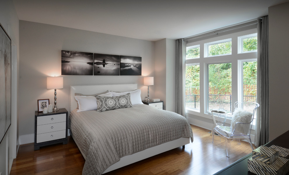 Example of a mid-sized trendy master bamboo floor bedroom design in DC Metro with gray walls