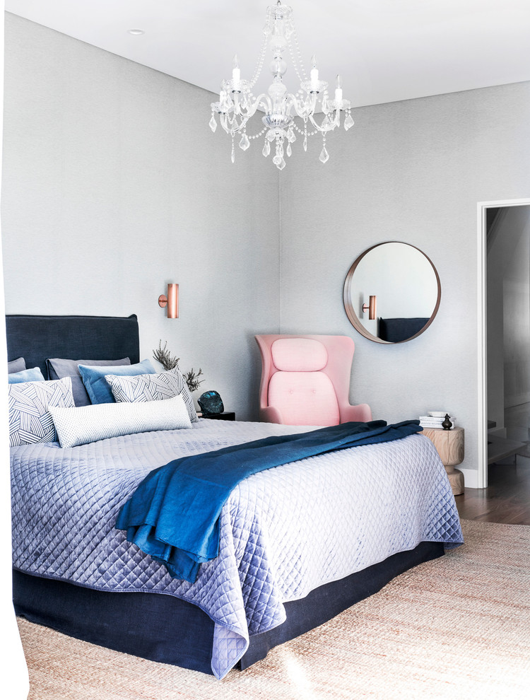 Medium sized contemporary master bedroom in Sydney with grey walls and light hardwood flooring.