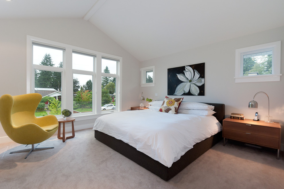 Contemporary bedroom in Vancouver with carpet.