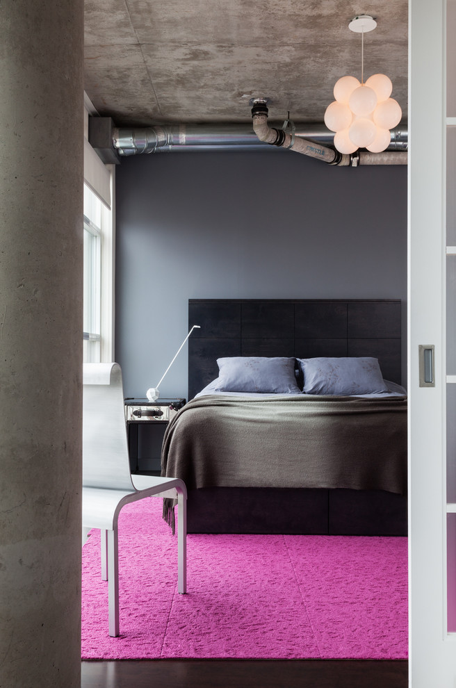 Medium sized contemporary master and grey and pink bedroom in Toronto with grey walls and dark hardwood flooring.