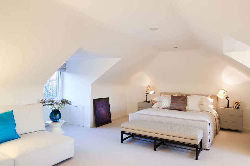 Photo of a medium sized modern guest bedroom in London with white walls, carpet and beige floors.