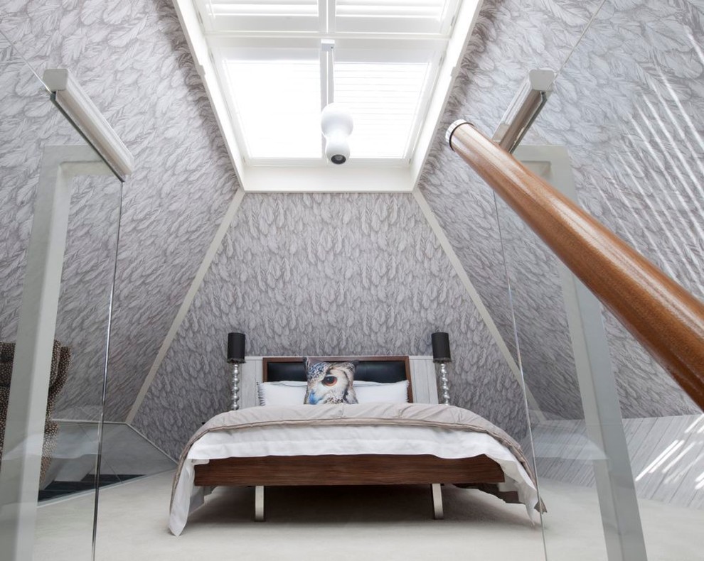 Bedroom - modern loft-style carpeted bedroom idea in Hampshire with gray walls