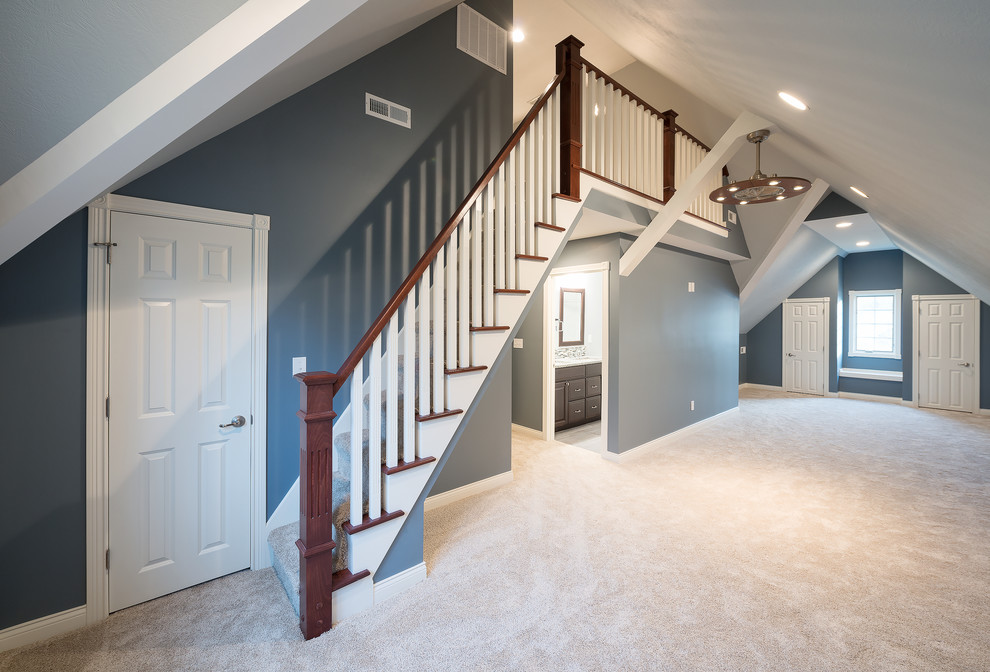 Large classic mezzanine bedroom in Indianapolis with blue walls, carpet and no fireplace.