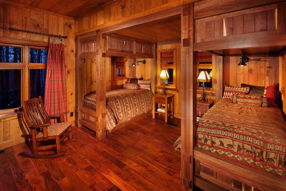 Example of a mountain style guest bedroom design in Other