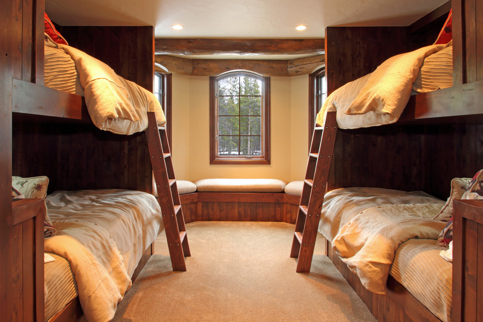 Example of a mid-sized classic guest carpeted bedroom design in Denver with beige walls and no fireplace