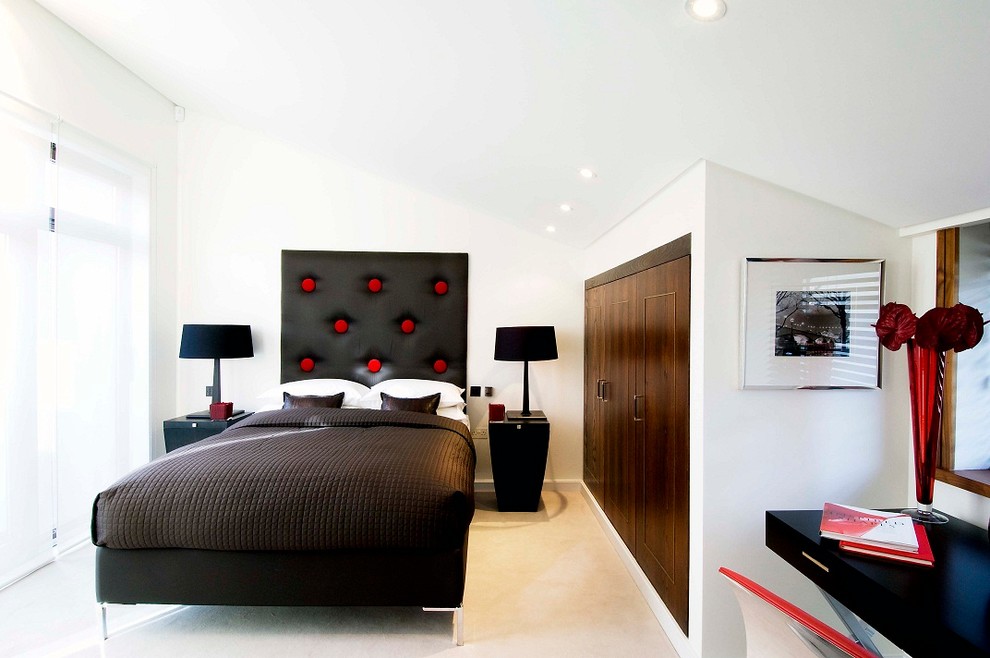 Inspiration for a contemporary bedroom in London with white walls and carpet.