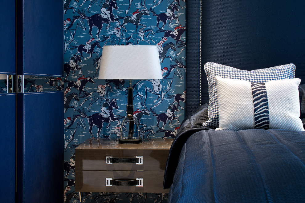 Inspiration for a large contemporary guest bedroom in London with blue walls and carpet.