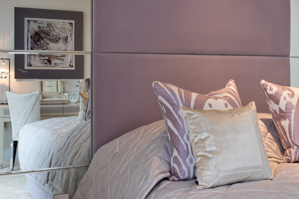 Photo of a large contemporary guest bedroom in London with pink walls and carpet.