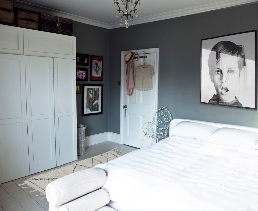 Inspiration for a mid-sized victorian master painted wood floor and white floor bedroom remodel in London with green walls