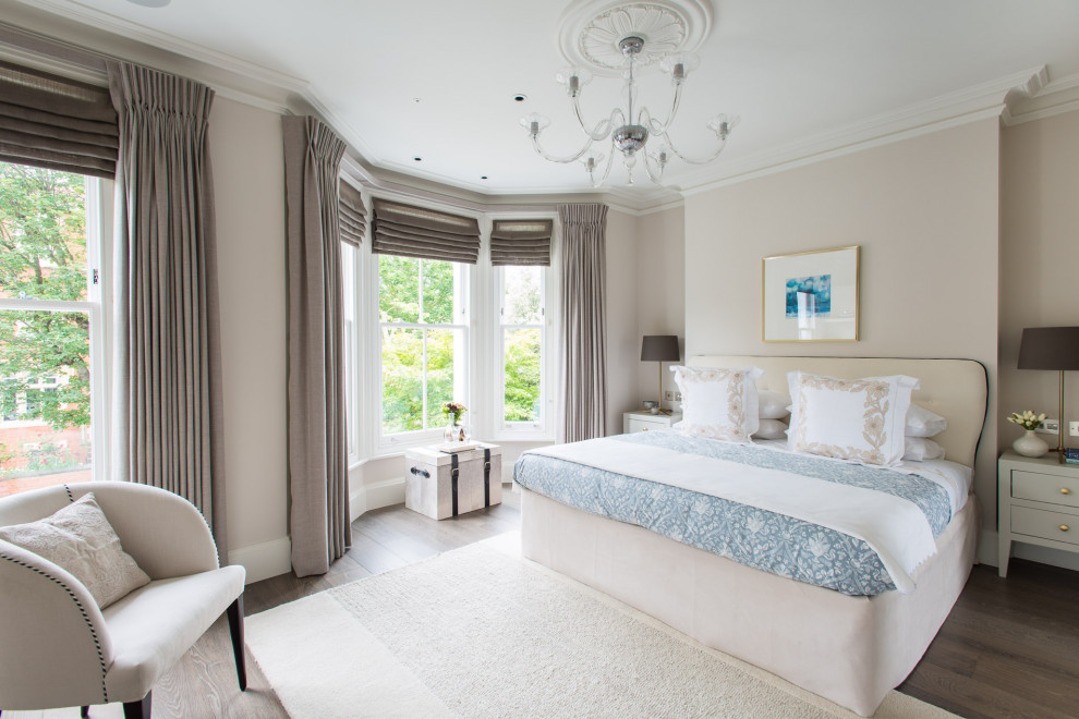 Photo of a large classic master bedroom in London.