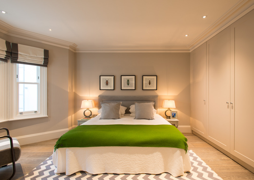 This is an example of a medium sized traditional bedroom in London.